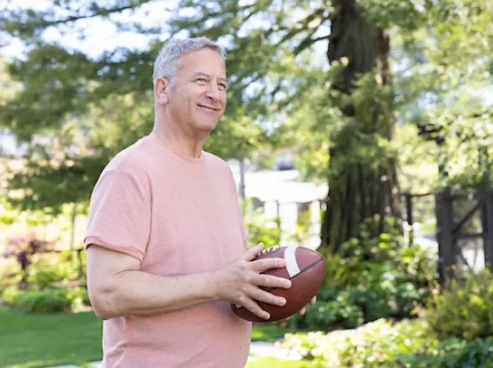 man with football in his hands